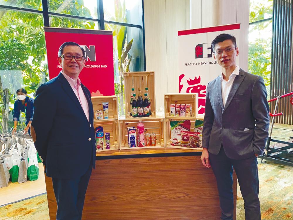Lim (left) and Tiong at the press conference.