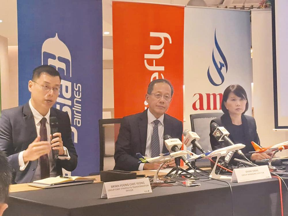 From left: MAG group chief strategy officer Bryan Foong, Izham and group CFO Boo Hui Yee, during the press conference.