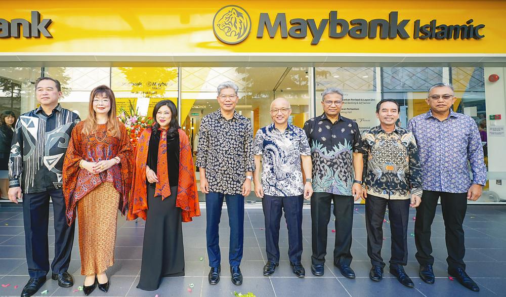 From left: Maybank commercial banking managing director Jason Wong, retail wealth management &amp; segment head Eunice Chan, group chief human capital officer Datuk Nora Abd Manaf, Khairussaleh, community financial services group CEO Datuk John Chong, community financial services Malaysia head Datuk Hamirullah Boorhan, community distribution head Mohd Zaini Aris and regional director, Selangor &amp; NS community distribution, Abdul Razak Kamardin at the opening of the Signature Branch.