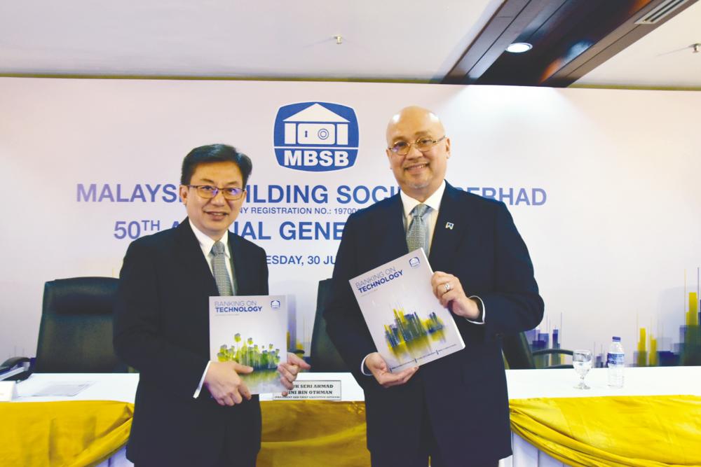 MBSB CFO Tang Yow Sai (left) and Ahmad Zaini at the group’s AGM