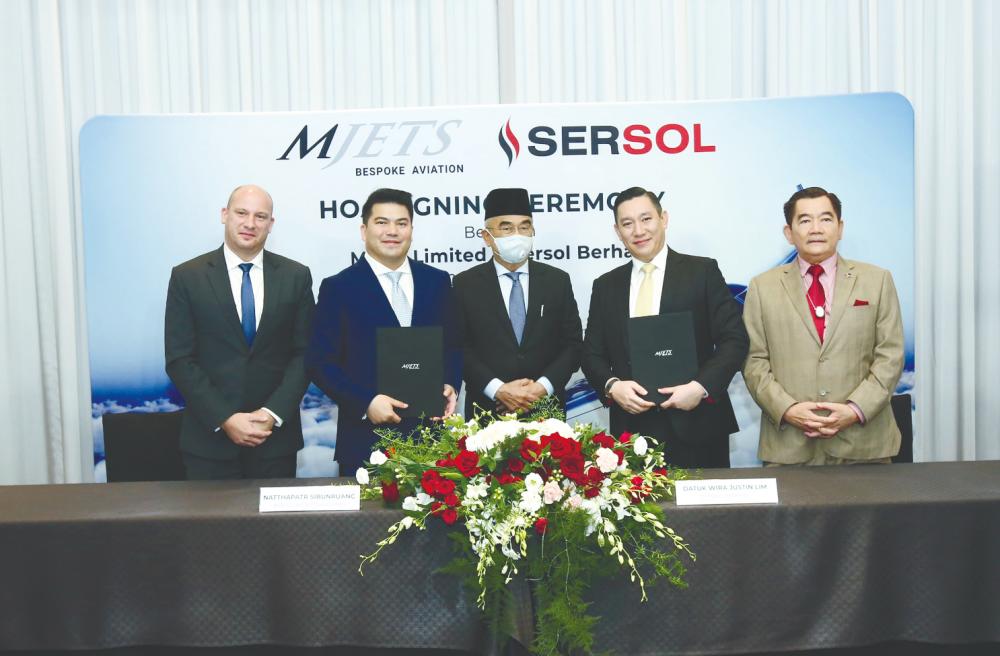 From left: MJets chief commercial officer Philippe Leysen, Natthapatr Sibunruang, Mohd Ali, Lim and Sersol Bhd group managing director Datuk Seri Tan Choon Hwa at the signing ceremony