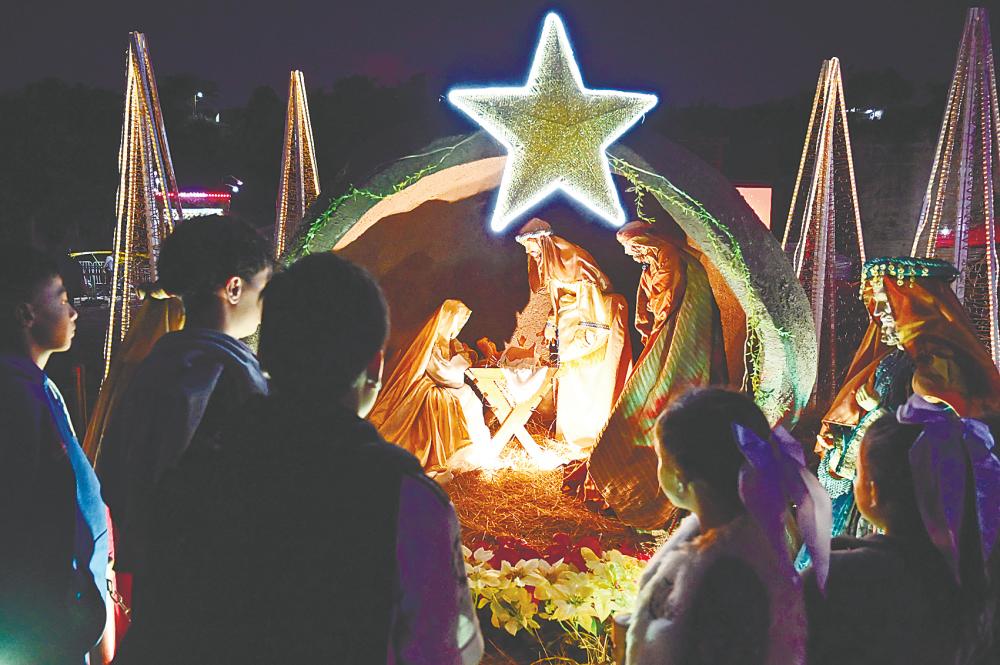 The manger scene denotes humility, simplicity and a more natural lifestyle under the stars, so to speak. Christmas is a reminder to be humble despite wealth, status, ethnic identity or religious standing. – AFPPIC