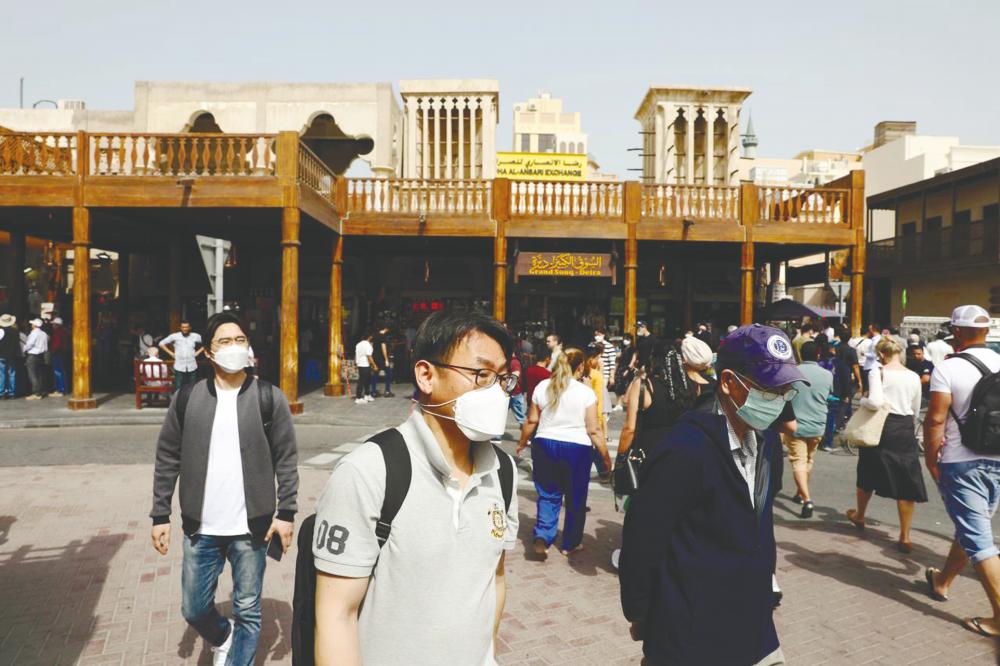 Tourists at old Dubai in early March. The UAE has introduced strict measures including halting travel and closing shopping malls and entertainment spots to curb the Covid-19 spread. – REUTERSPIX
