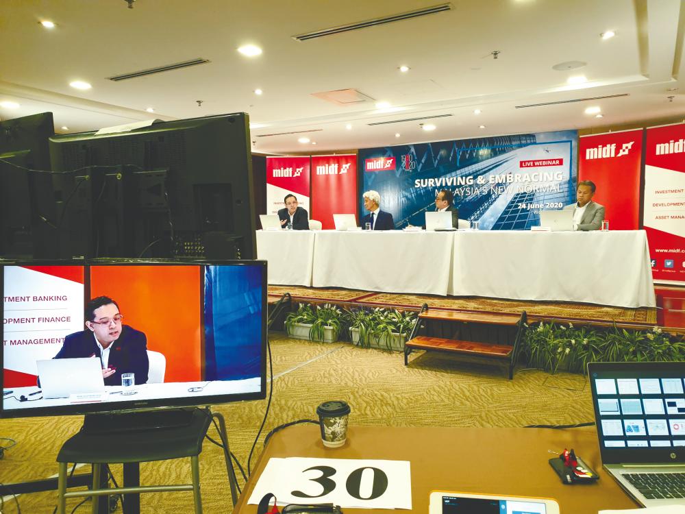 Screen shows Imran speaking during the webinar.