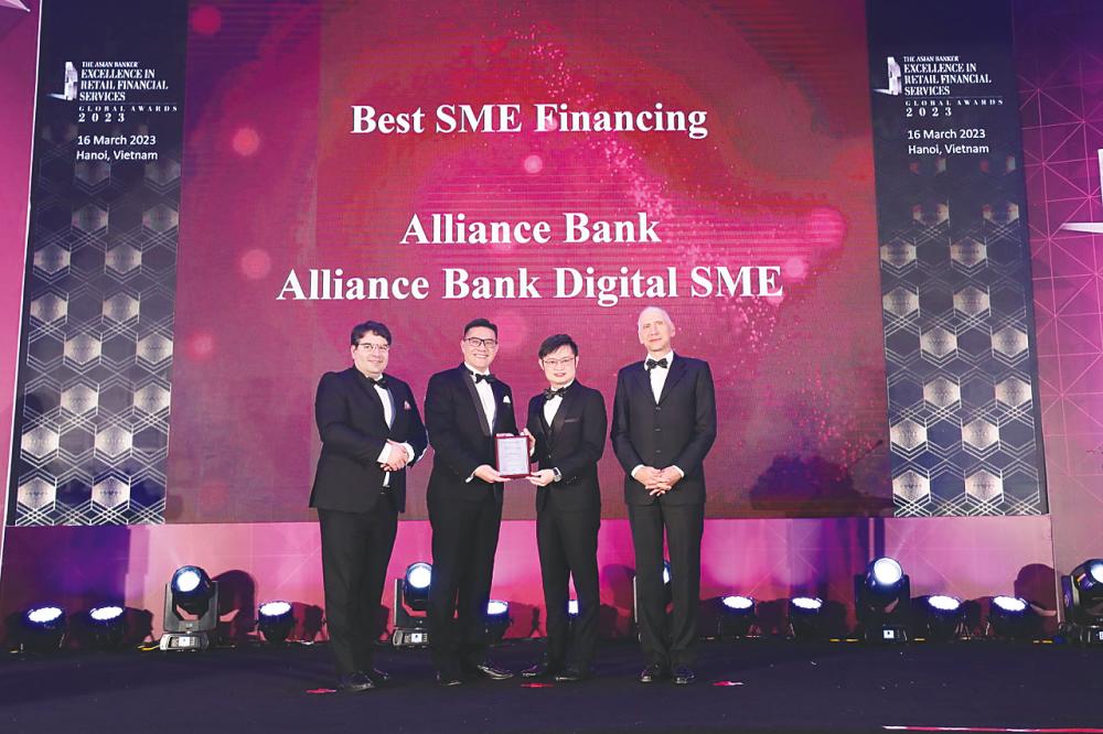 Accepting the Best SME Financing Award 2023 on behalf of Alliance Bank are Chui (second from left) and the bank’s digital SME head Kevin Shum (second from right). They are flanked by The Asian Banker Global international resource director and Excellence Awards Advisory Council member David Gyori (left) and The Asian Banker Global research director Christian Kapfer.