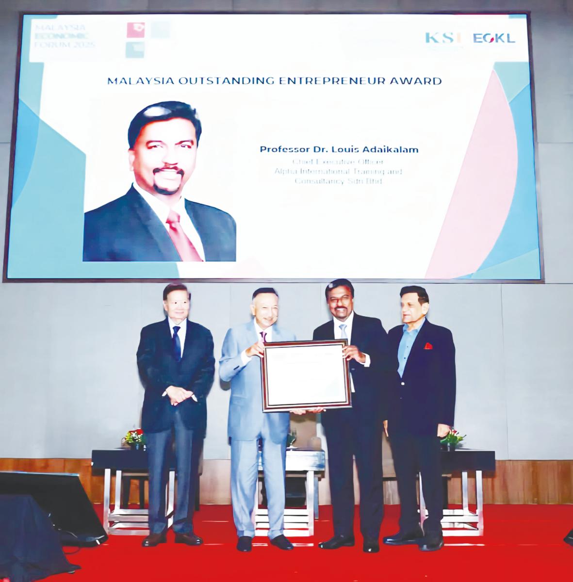Tunku Datuk Seri Utama Naquiyuddin ibni Almarhum Tuanku Ja’afar (second, left presenting the KSI Strategic Institute for Asia Pacific’s Malaysia Outstanding Entrepreneurs Award 2025 to Adaikalam. They are flanked by KSI Strategic Institute for Asia Pacific president Tan Sri Michael Yeoh (left) and deputy chairman Datuk Seri Mohd Iqbal Rawther.
