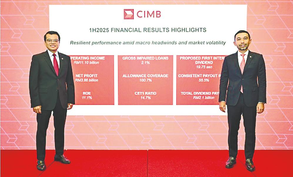 Novan (right) and chief financial and strategy officer Khairul Rifaie at CIMB Group’s first-half financial results press conference today.