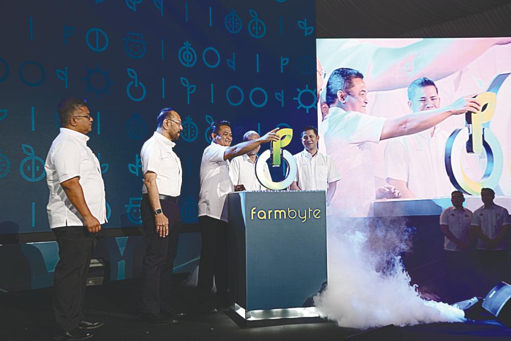 At the launch of FarmByte Food Hub are (from left) Kulim (Malaysia) managing director Mohd Faris Adli Shukery, Syed Mohamed; Zahari, Johor Islamic Corporation general manager Muzaldin Mohamed and FarmByte CEO Aiman Syed Jaafar.