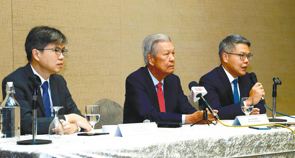 From left: Hartalega chief business officer Kuan Mun Keng, executive chairman Kuan Kam Hon, and Kuan Mun Leong at a press conference after the group’s 17th AGM.