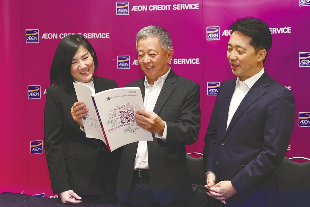 From left: Lee, Ng, and Aeon Cedit managing director Daisuke Maeda at the press conference after its AGM.