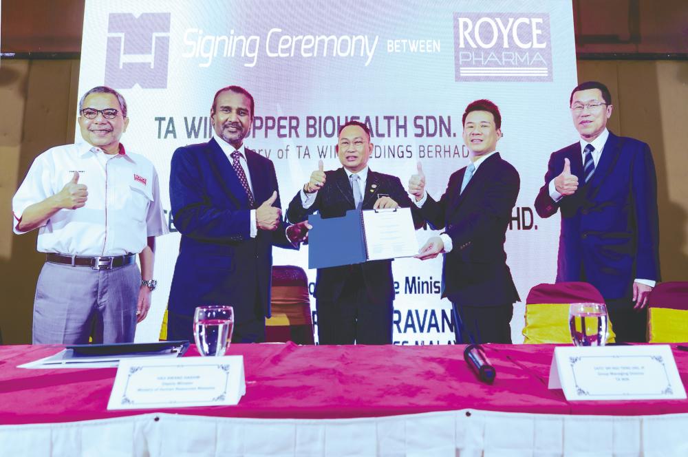 From left: Royce Pharma president Zainal Ariff Mahmood, Chandrasekar, Deputy Human Resources Minister Awang Hashim, Ngu and Ta Win executive director Tan Poo Chuan at the signing ceremony.