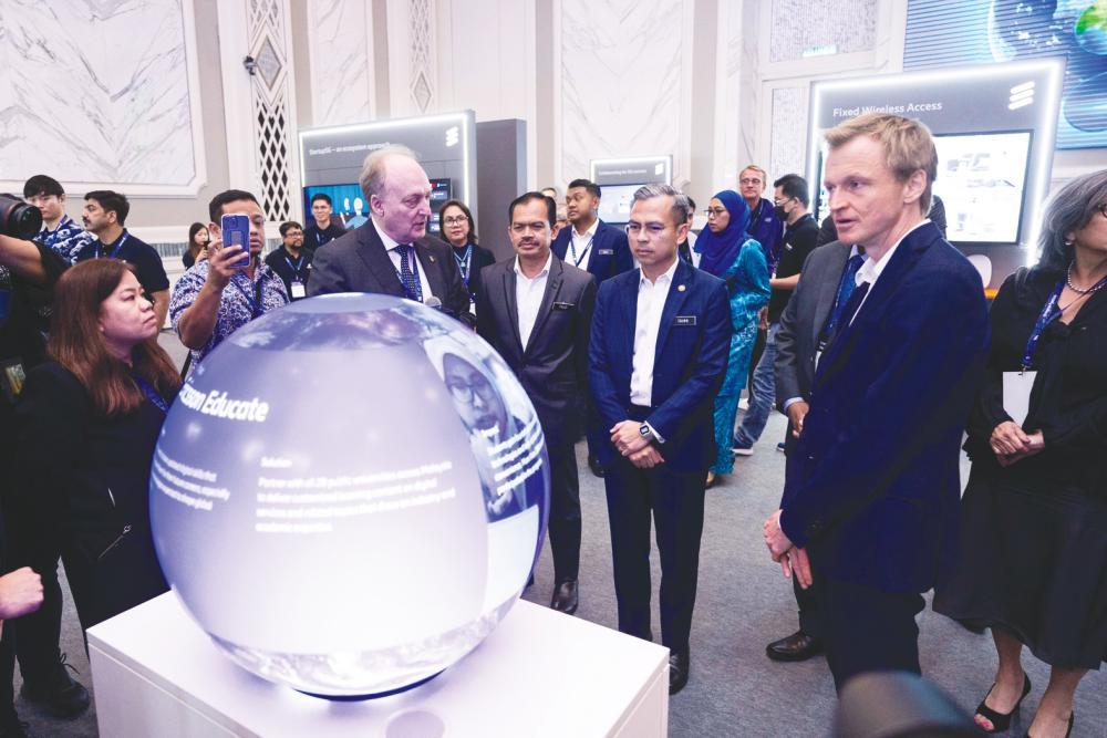 From left: Ericsson Apac chief technology officer Dr Magnus Ewerbring, CDM secretary-general Datuk Mohamad Fauzi Md IIsa, Fahmi and Hägerbro at the event.