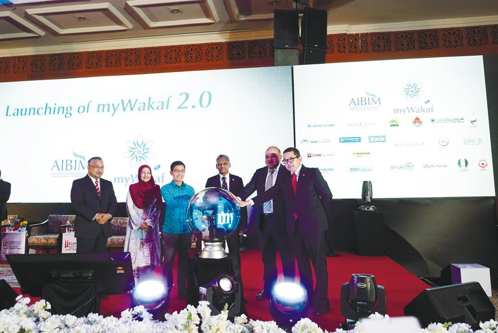 From left: BIMB Group chief financial inclusion officer Mohd Nazri Chik, AIBIM executive director Ratna Sha’erah, group CEO Mohd Muazzam Mohamed, Abdul Rasheed, Bank Muamalat CEO Khairul Kamarudin, and CIMB Islamic CEO Ahmad Shariman at the myWakaf 2.0 launch.