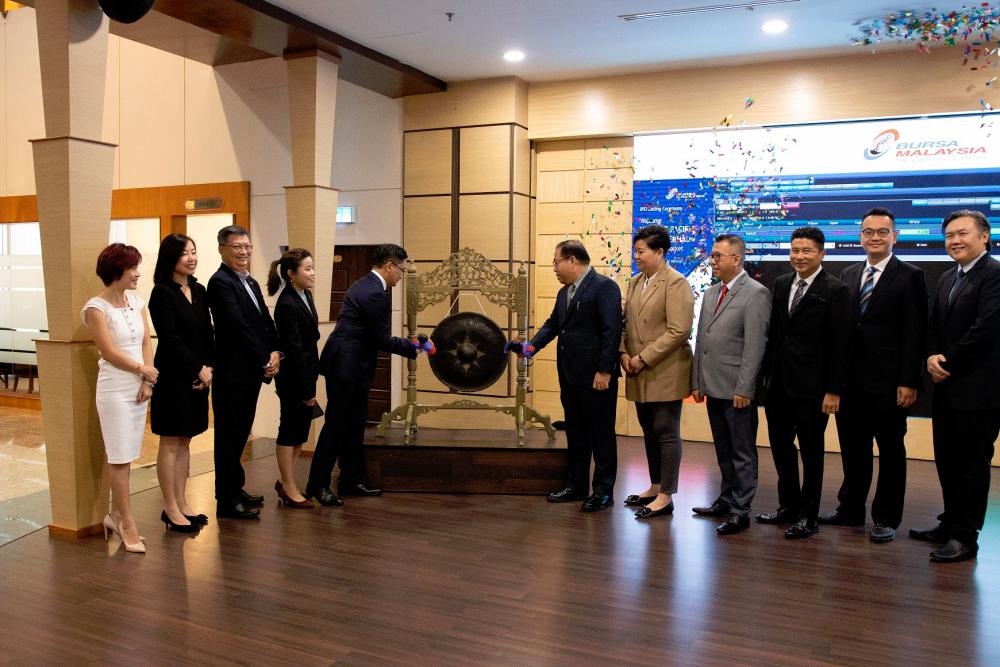 From left: Yew Lee Pacific Group Bhd directors Andrea Huong, Lim See Tow, Andrew Yaw, Ang Poh Yee, Mahdzir, managing director Ang Lee Leong, executive directors Chee Wai Ying and Ang Lee Seng, M&amp;A Securities Sdn Bhd managing director of corporate finance Datuk Bill Tan, deputy head of corporate finance Danny Wong, and Eco Asia Capital Advisory Sdn Bhd financial adviser Woon Soon Fai at the listing ceremony.