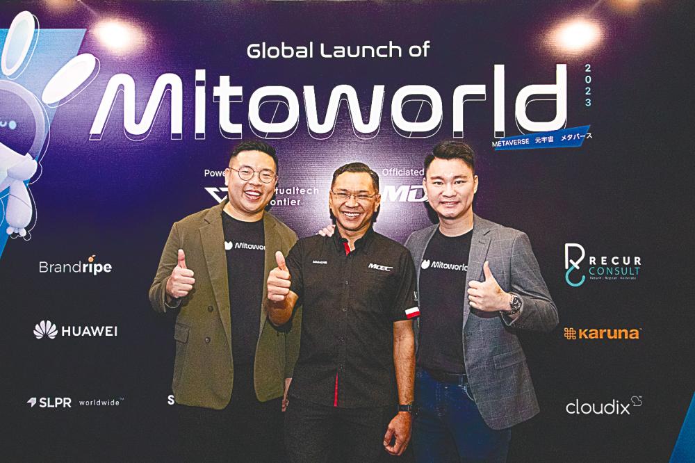 From left: Tan, Malaysian Digital Economy Corporation CEO Mahadhir Aziz and Low at the launch.