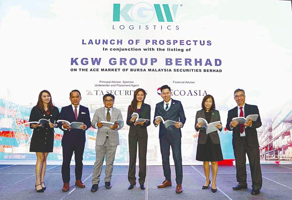 From left: Eco Asia Capital Advisory Sdn Bhd director Kelly Neng and managing director Kelvin Khoo, TA Securities Holdings Bhd corporate finance head Ku Mun Fong, KGW Group Bhd chairman Tengku Faizwa Tengku Razif, Wong, KGW Group director/COO Cheok Hui Yen and TA Securities (operations) director Tah Heong Beng, at the IPO prospectus launch.