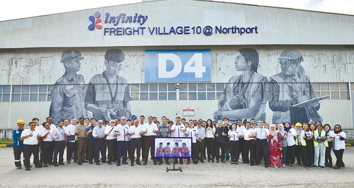 (Front row) Port Klang Authority chairman Ean Yong Hian Wah (12th from left); Chan (13th from left); Azman Shah (11th from left); Fakhrul Azhar (10th from left) and Koh (16th from left) photographed together with guests during the mural art launch at Warehouse D4.