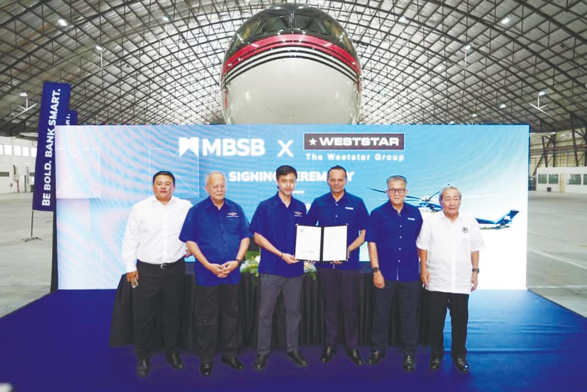 From left: National Aerospace Defence Industries Sdn Bhd (Nadi) president Datuk Edron Hayata Ahmad, Syed Azman, Weststar Group director Syed Muhammad Azni Syed Azman, MBSB Group CEO Rafe Haneef, Wan Kamaruzaman and Nadi Group chairman Tan Sri Ahmad Johan at the MBSB-Weststar MoU signing ceremony.