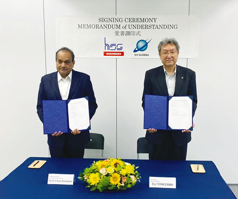 Sittampalam (left) and OC Global president &amp; CEO Eiji Yonezawa at the signing ceremony.