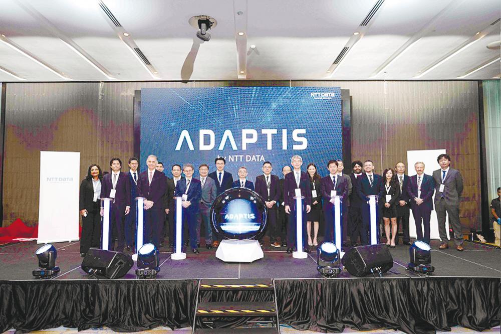 From left, front: NTT Data Payment Services CEO (e-commerce solutions) Yuichiro Sato, Hesh, Nishikawa, NTT Data Japan director and senior executive vice-president Isao Arima and deputy senior vice-president, head of payment services Sector, Masanori Kurihara, and NTT Data Payment Services CEO (payment services and e-pay) Enoch Chhabra at the launch of Adaptis in Kuala Lumpur.