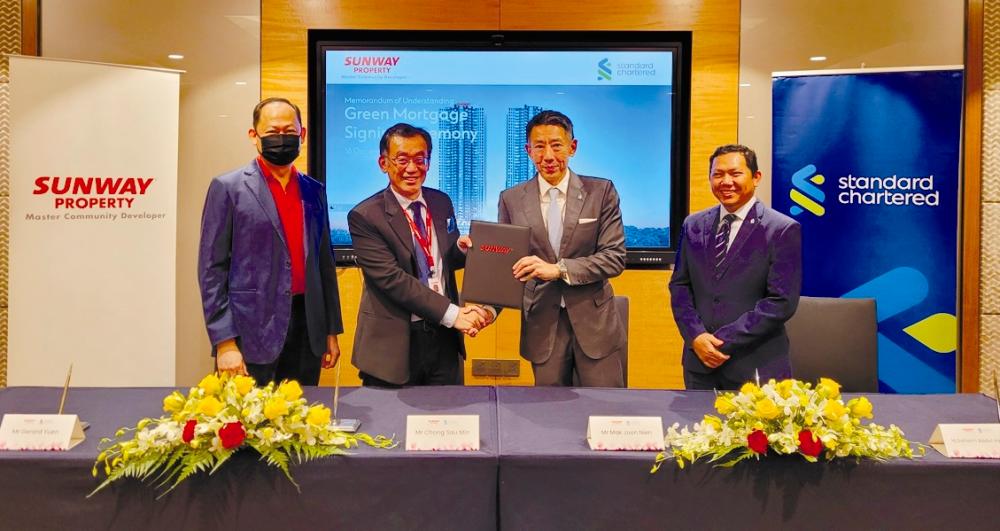 From left: Sunway Property chief brand &amp; marketing officer Gerard Yuen, Chong, Mak and Standard Chartered Saadiq Malaysia CEO Mohd Suhaimi Abdul Hamid at the MoU signing.
