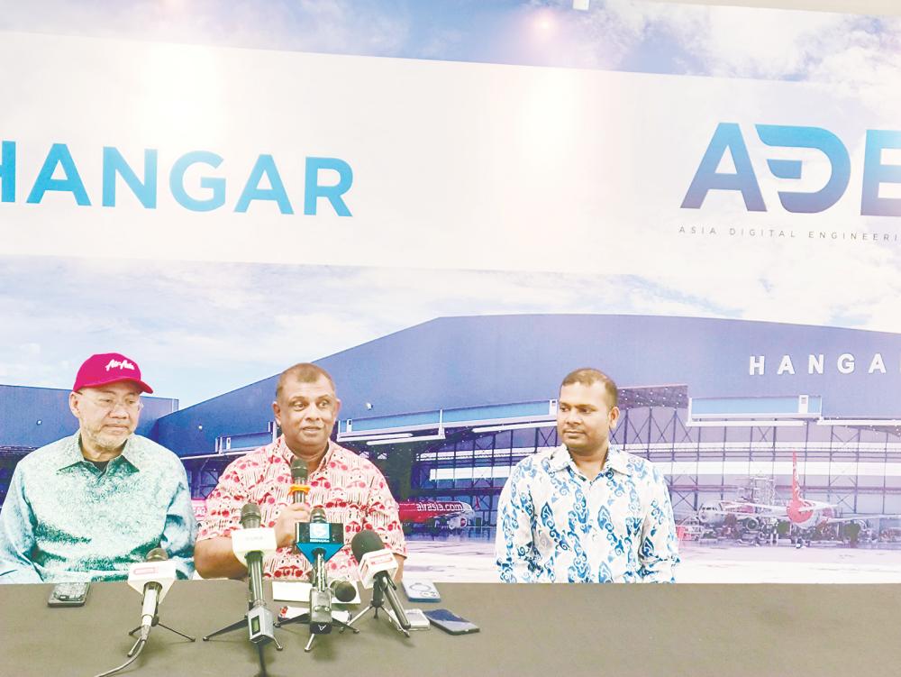 From left: Capital A Bhd executive chairman Datuk Kamarudin Meranun, Fernandes and Mahesh at the press conference. – AMIRUL SYAFIQ/THESUN