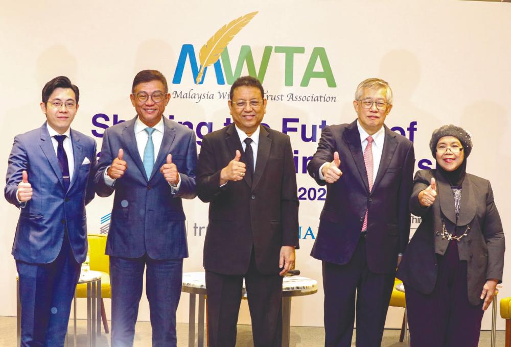 From left: Amanah Raya Bhd group chief business officer Jack Yap Ngee Heong, Chua, Zico Trust (M) Bhd chairman Tan Sri Dr Nik Norzrul Thani, Zico Holdings Inc executive director Chew Seng Kok and Norsaidatul at the forum. – AMIRUL SYAFIQ/THE SUN