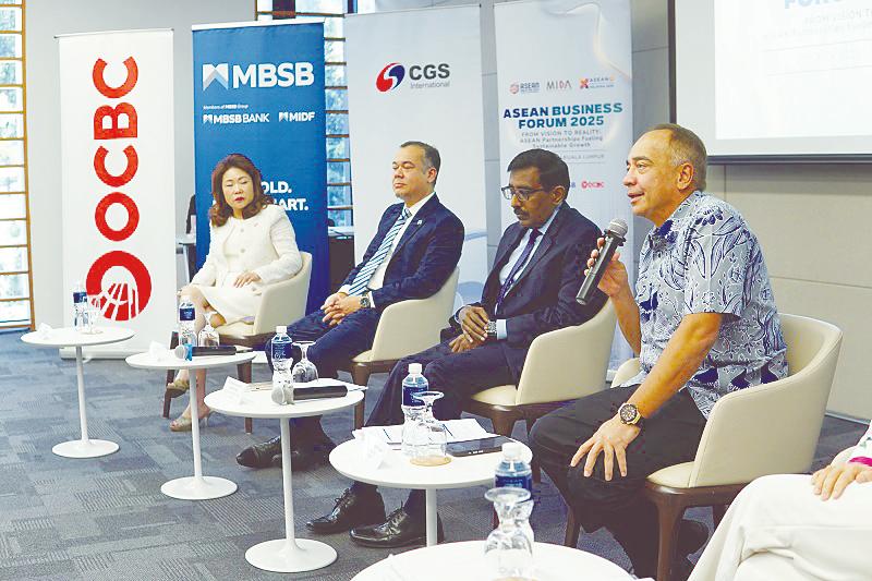Nazir speaking to reporters at the curtain raiser to Asean Business Forum 2025 today. With him are, from left, OCBC Malaysia managing director, senior banker and head of investment banking Tan Ai Chin, Azlan and Sivasuriyamoorthy.