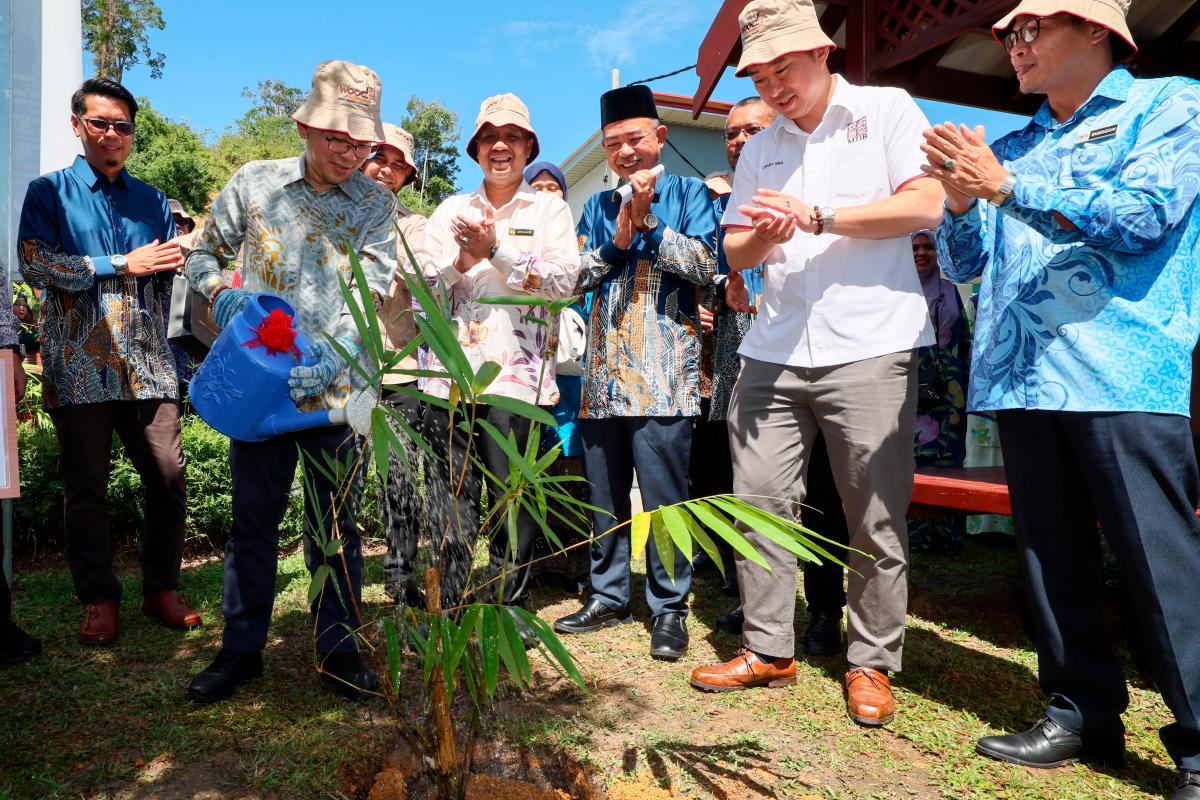 Chan (second, left) watering a bamboo plant to mark the opening of World Bamboo Day Malaysia 2025 at the Bamboo Model Farm, Terengganu Timber Industry Training Centre in Kuala Berang. – Bernamapic