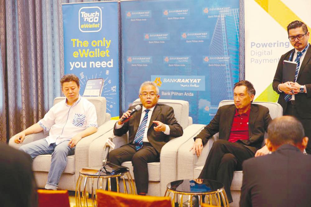 From left: Ni, Mohammad Hanis and Payments Network chief commercial officer Gary Yeoh at a press conference on the Bank Rakyat-Touch n’ Go collaboration.