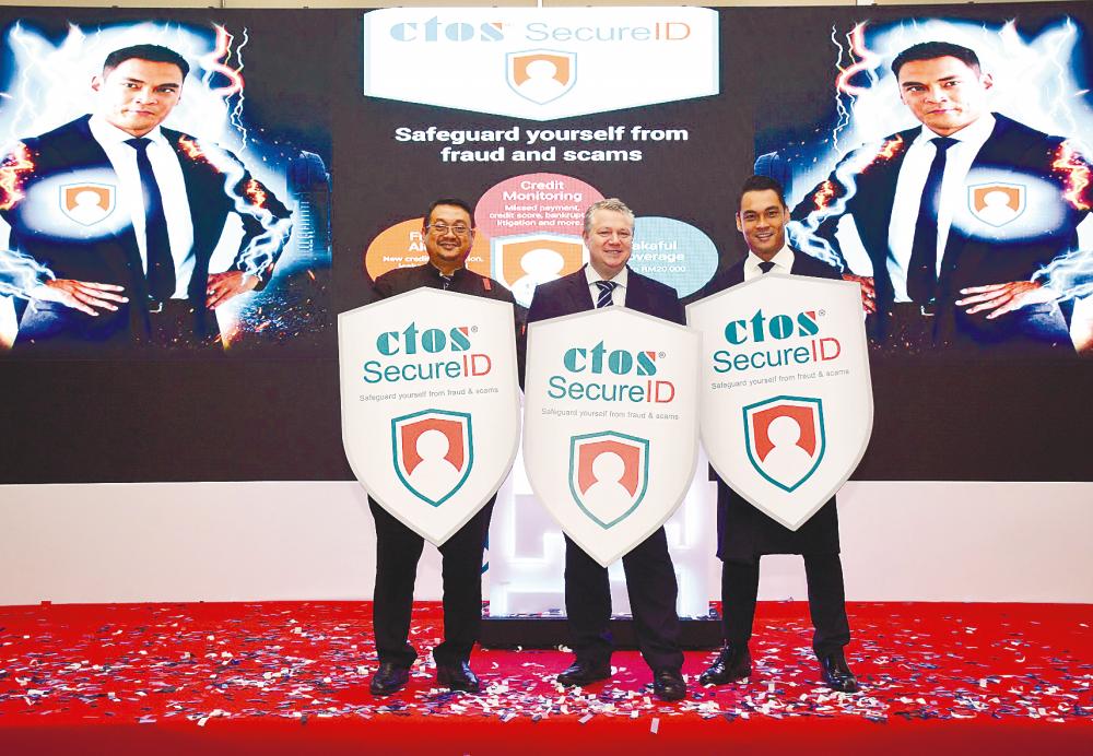 From left: Cybersecurity Malaysia CEO Datuk Amirudin Abdul Wahab, Martin and film &amp; TV star Hisyam Hamid at the launch of CTOS SecureID.