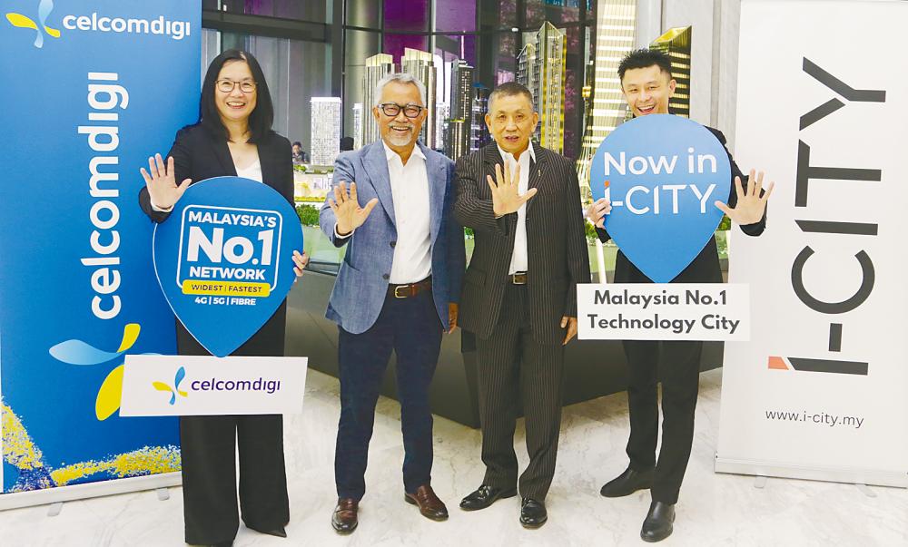 From left: CelcomDigi chief home &amp; fibre officer Chee Loo Fun, Idham, Lim and I-Berhad chief technology officer Ricky Lim.