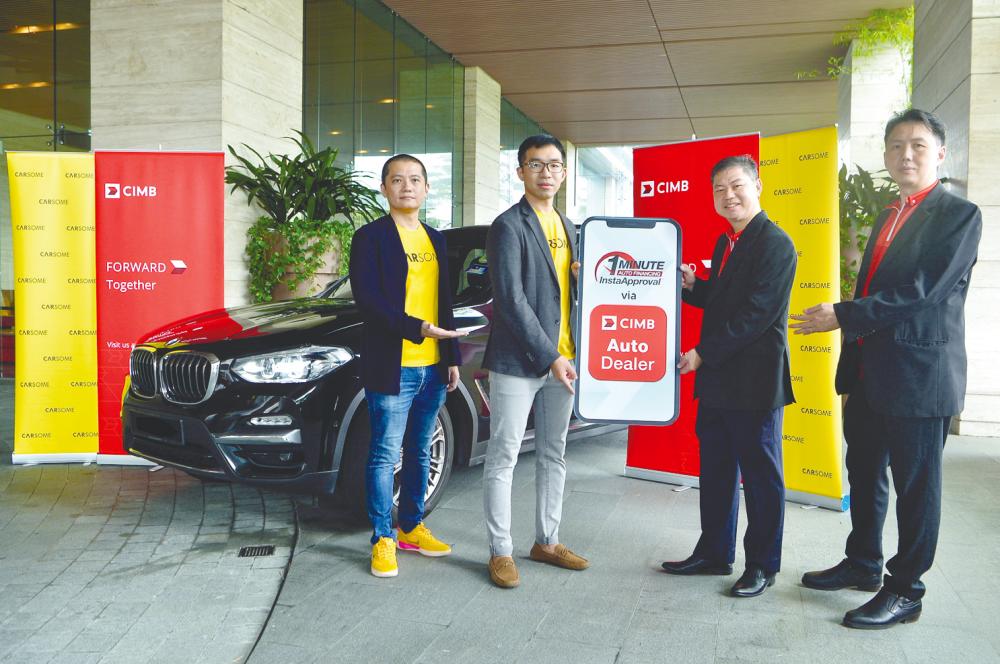 From left: Carsome Certified Malaysia country general manager Alan Cheah, Carsome Certified CEO Mei Han, CIMB head of consumer banking Malaysia Daniel Cheong and CIMB head of automotive financial services, retail &amp; enterprise distribution Malaysia Chia Hoe Kit at the CIMB Auto Dealer app ceremony.