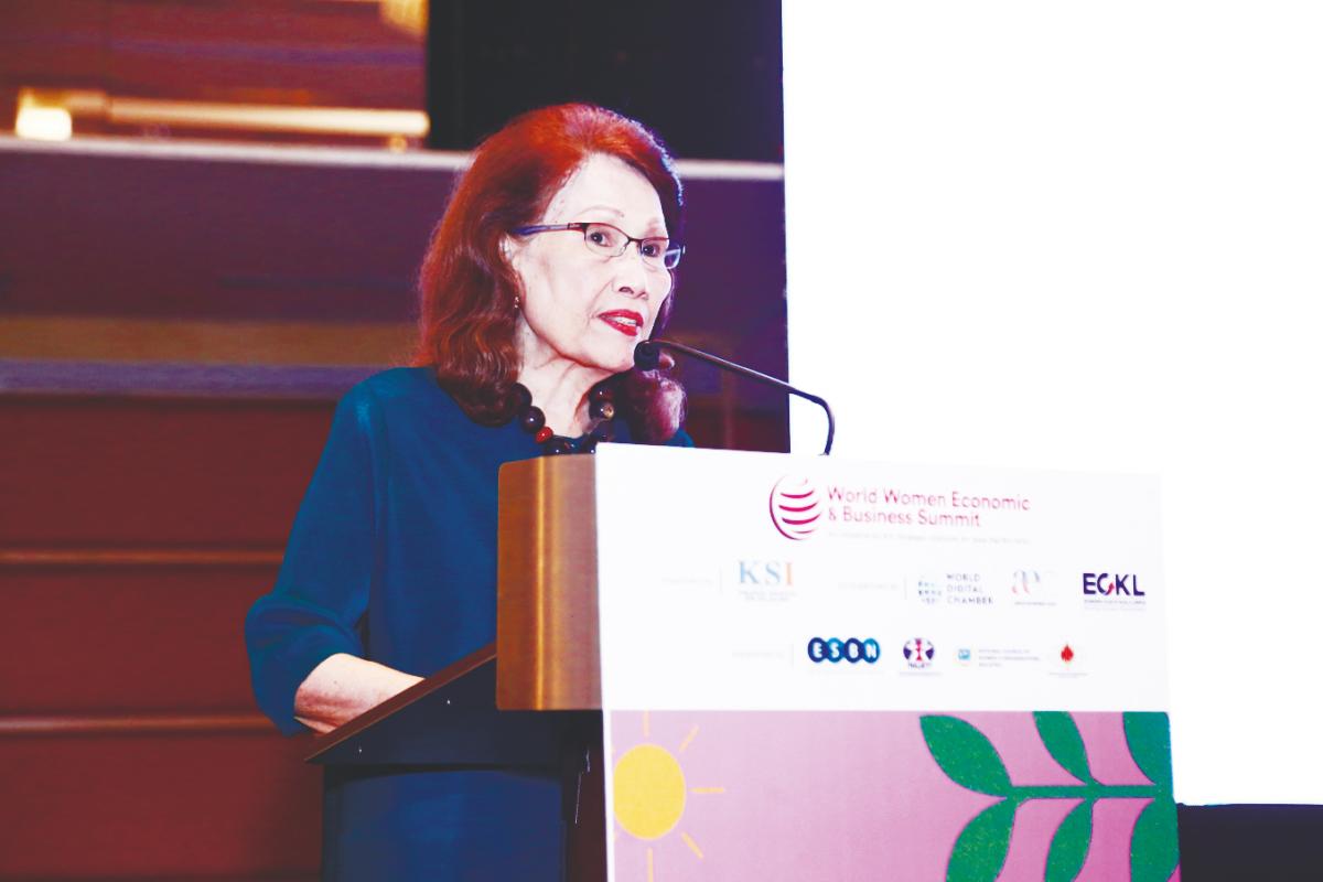 Halimah delivering her address at the 2025 World Women Economic and Business Summit.