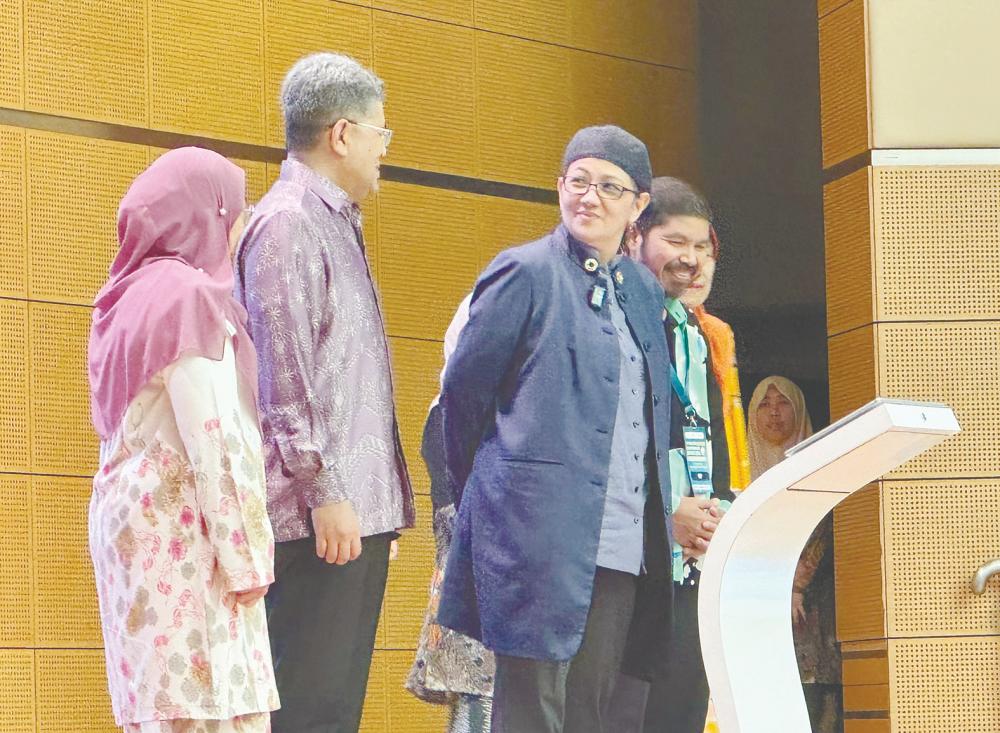 Hanifah Hajar (second from right) at the launching ceremony of the conference.