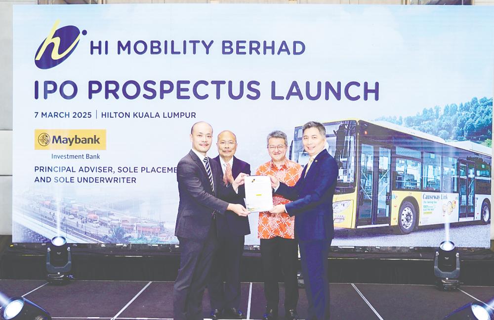 From left: Lim, HI Mobility founder Lim Wan Heng, Deputy Investment, Trade and Industry Minister Liew Chin Tong and Maybank Investment Bank Bhd CEO Michael Oh-Lau at HI Mobility’s prospectus launch.