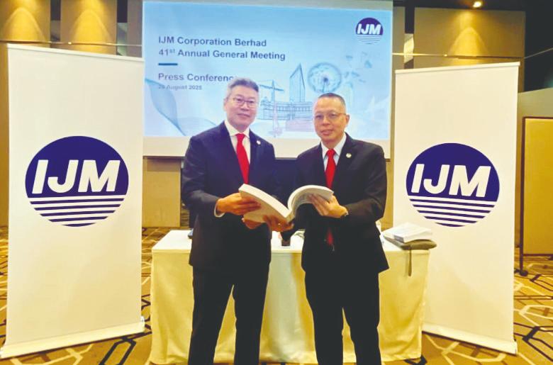 Lee (left) with group chief financial officer Datuk Edward Chong at the press conference after IJM Corporation’s AGM in Kuala Lumpur.