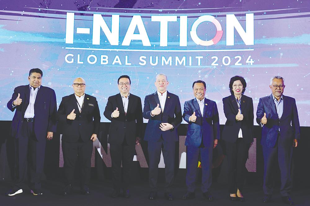 Deputy Prime Minister Datuk Seri Fadillah Yusof (centre) and Chang (third from left) with other dignitaries at the launch of i-Nation Global Summit 2024 today. – Bernamapic