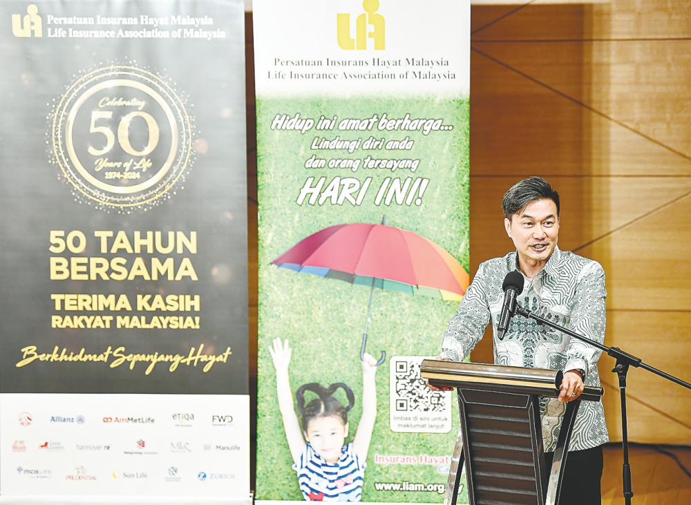 Lew delivering his speech at the launch of i-Mula 50. – Bernamapic