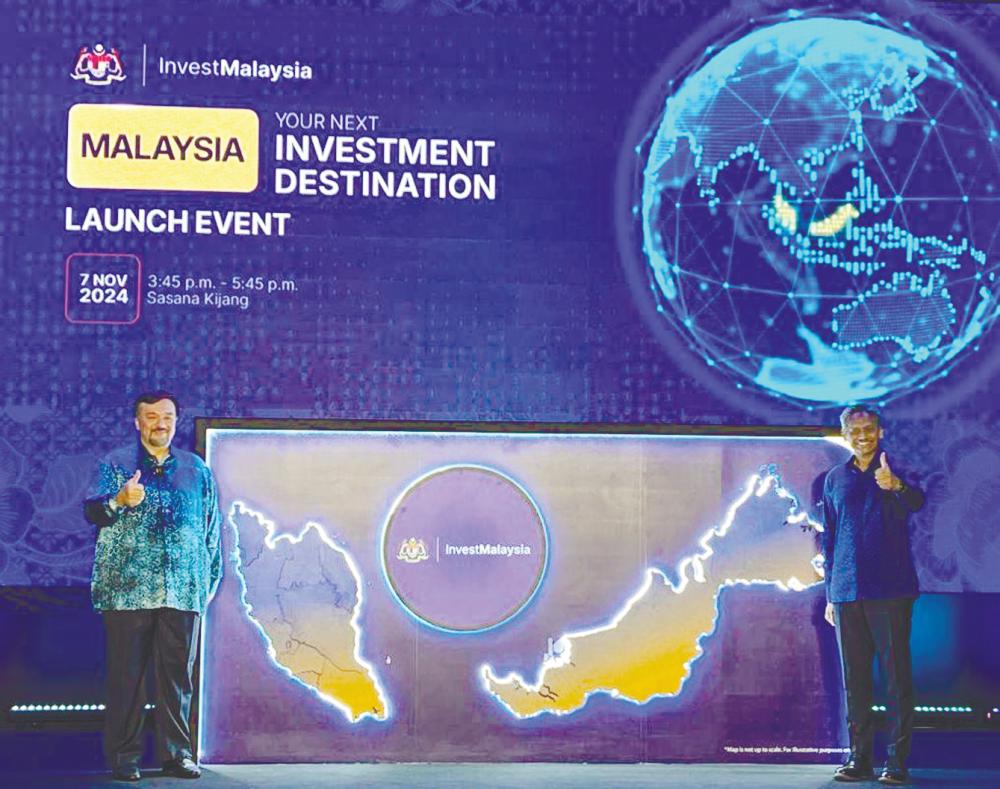 Amir Hamzah (left) and Abdul Rasheed at the launch of the InvestMalaysia portal.