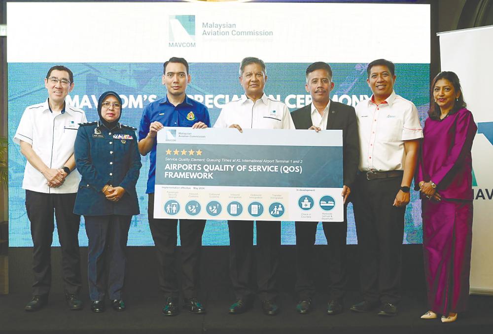 From left: Mavcom COO Raja Azmi Raja Nazuddin, KLIA Customs deputy director Nor Azmah Abdul Rahim, KLIA Immigration deputy director Nooruladzim Ateman, Saripuddin, KLIA deputy district police chief Supt Samsolnizam Kassir, MAHB acting group CEO Mohamed Rastam Shahrom and Mavcom consumer and public affairs director Pushpalatha Subramaniam.