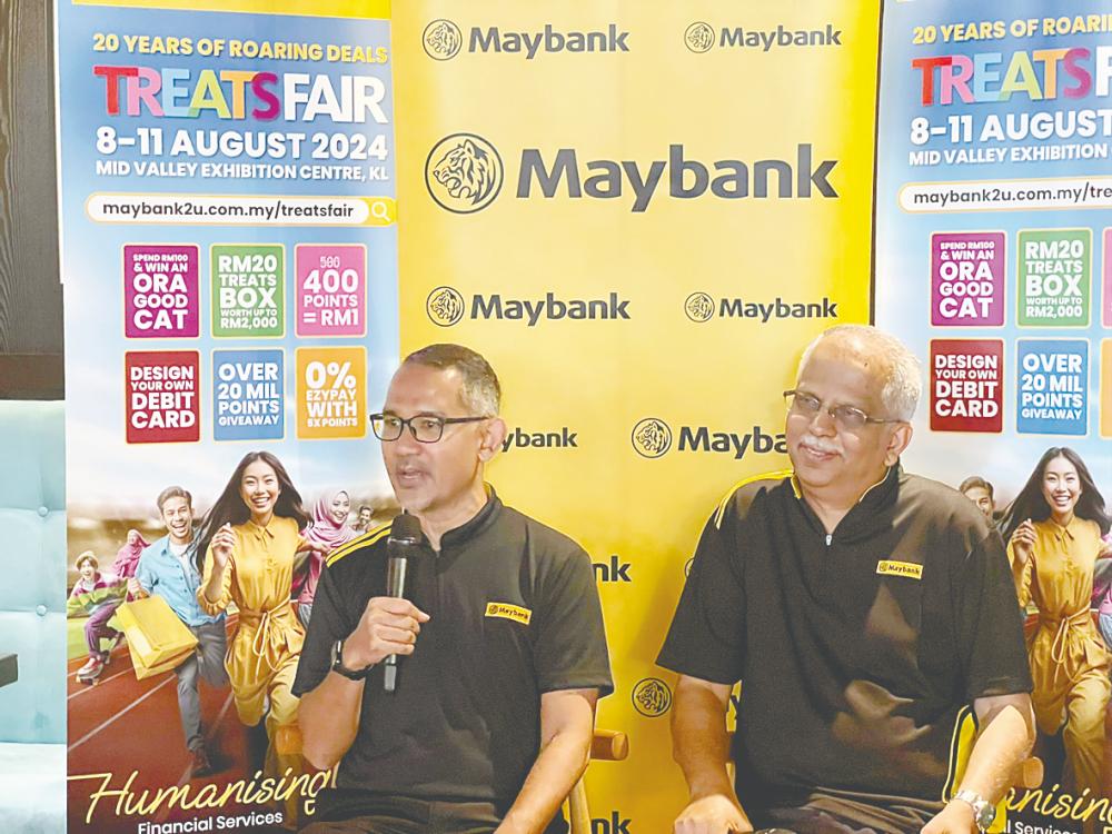 Syed Ahmad (left) and Ravintharan at a press conference on Maybank Treats Fair 2024.