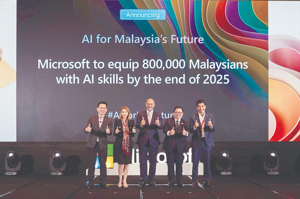 From left: Si; Microsoft Asean president Andrea Della Mattea, Gobind, Digital Ministry secretary-general Fabian Bigar, Petroliam Nasional Bhd group technology and commercialisation vice-president Izwan Ismail at the Microsoft Cloud and AI Summit Malaysia celebrating the launch of the AI for Malaysia’s Future initiative.