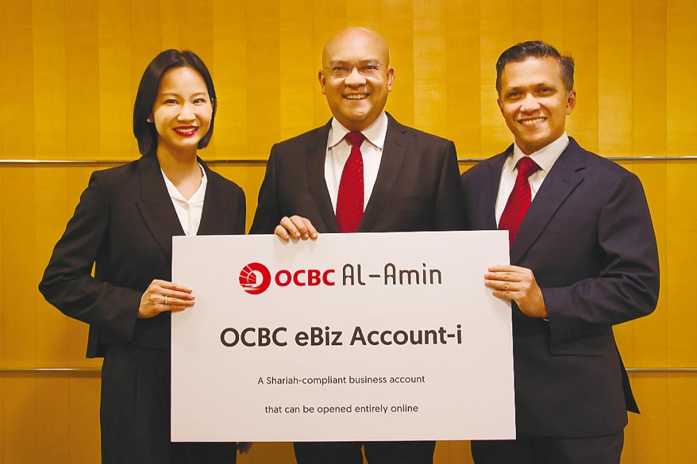 From left: OCBC Bank (M) marketing of emerging business head Amanda Gan, Syed Abdull Aziz, OCBC Al-Amin Bank Islamic product &amp; business development head Mohd Kamal Abdul Karim.