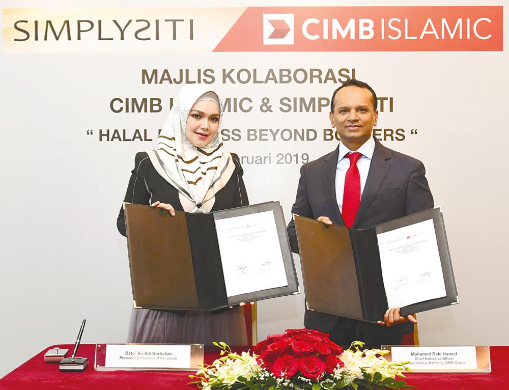 SimplySiti founder and president Datuk Seri Siti Nurhaliza Tarudin and Rafe at the signing ceremony in Kuala Lumpur yesterday.