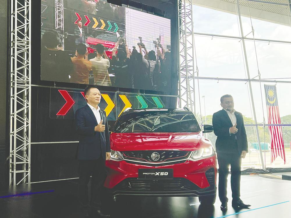 Li (left) and Roslan at the launch of 2024 Proton X50 RC.