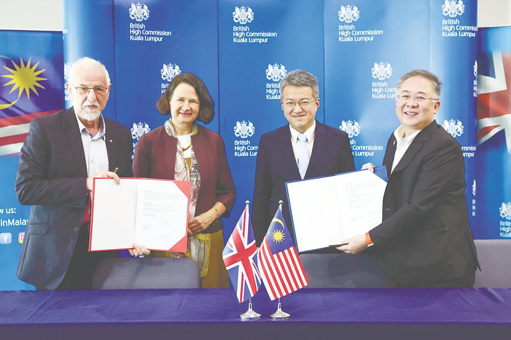 From left: Semiwise Ltd CEO Prof Asen Asenov, Wise, Liew and Chin at the MoU exchange ceremony today. – Bernamapic