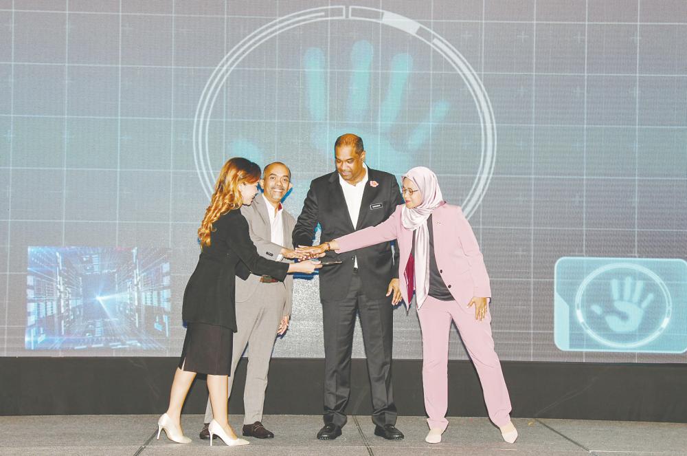 Mohammad Hardee (second from left), Ramanan (third from left) and Zakiah (right) at the launch of SME Bank’s Sustainability Roadmap 2.0.