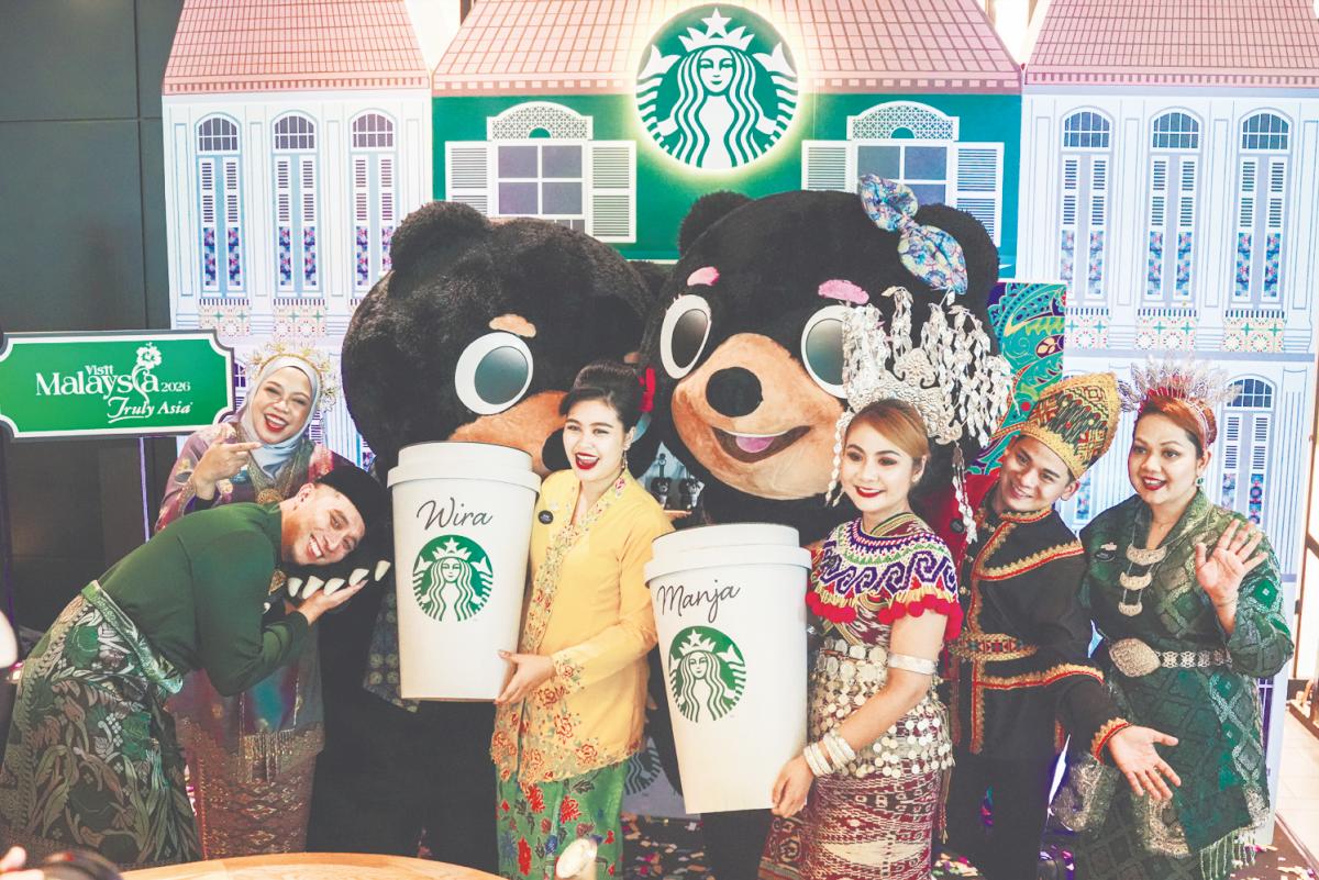 Mascots Wira and Manja with Starbucks Malaysia Hospitality Specialists.