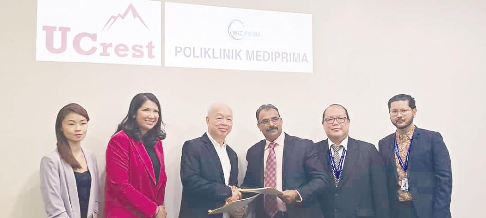 From left: UCrest assistant director Evelyn Liew, digital health director Viva Shaik, Eg, Dr Anbalagan, Mediaprima Healthcare general manager Jeffrey Lam and assistant general manager Dr Mohd Aidid Rizal at the signing ceremony.